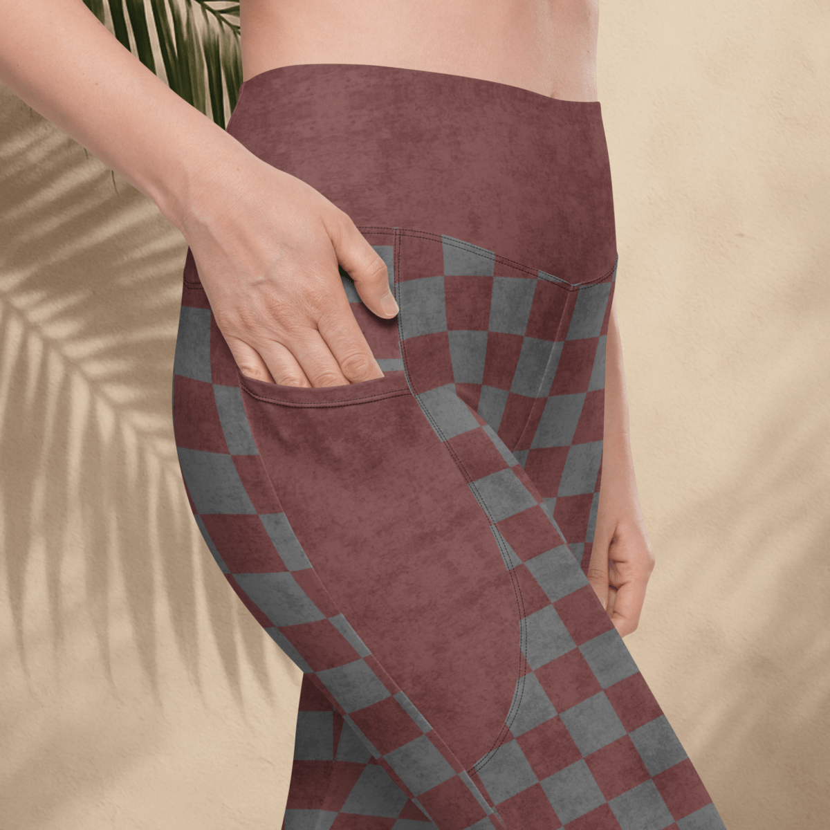 burgundy and gray checkered pants with a pocket on a beige background