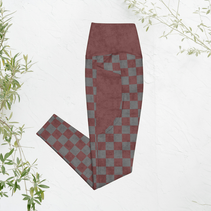 burgundy and gray checkered pants on a white background with green leaves.