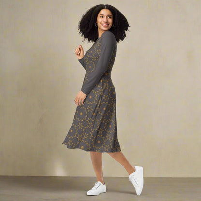 Woman wearing a patterned dress with white sneakers on a beige background