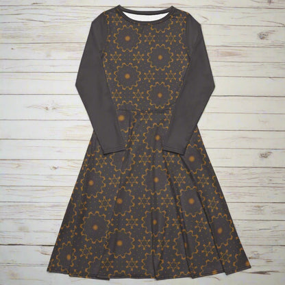 Dark gray dress with geometric pattern on a wood background
