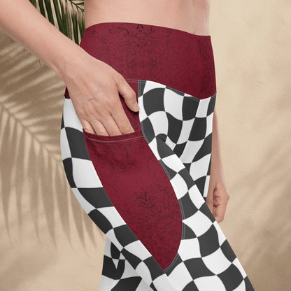 Person wearing burgundy and checkered leggings with a beige background