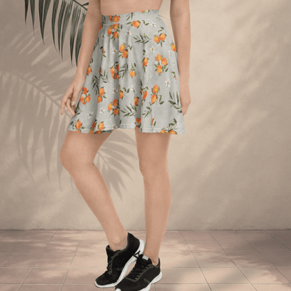 Person wearing a floral skirt with a neutral background
