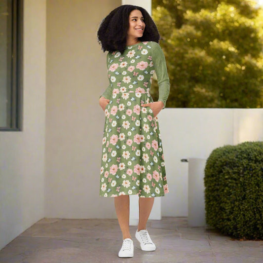 Woman wearing a green floral dress standing outdoors.