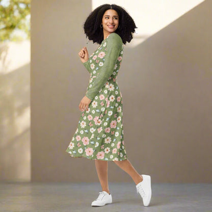 Woman wearing a green floral dress on a beige background