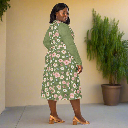 Woman wearing a green floral dress on a neutral background