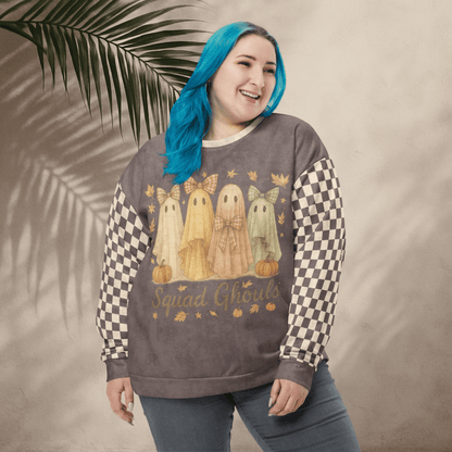 Person wearing a sweatshirt with ghost designs and 'Squad Ghouls' text, standing against a neutral background with a leaf.