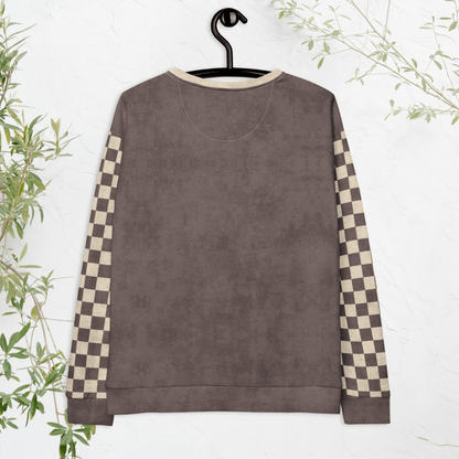 Brown sweatshirt with checkered sleeves on a hanger against a white background