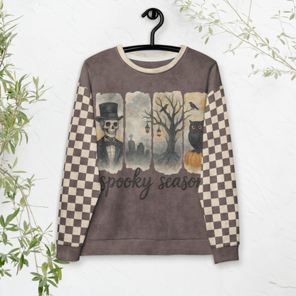 Sweatshirt with Halloween-themed design on a hanger against a white background