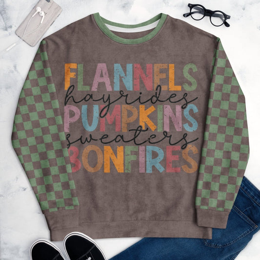 Espresso and sage green Sweatshirt with colorful text and checkered sleeves on a marble surface