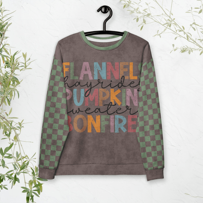 Espresso and sage green Sweatshirt with colorful text and checkered sleeves on a hanger against a white background