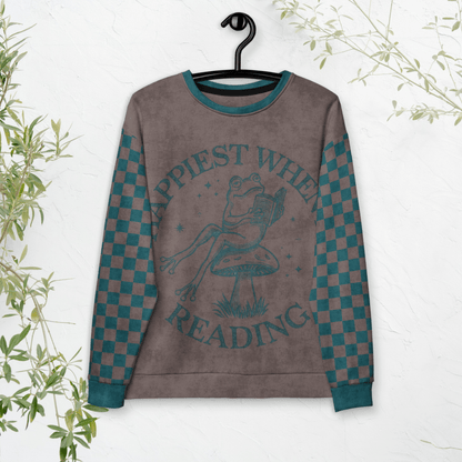 Sweatshirt with a Frog reading with "Happiest When I'm Reading" design on a white background