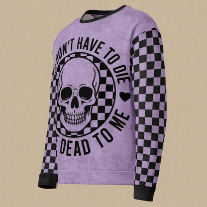 Purple sweatshirt with skull design and text on a beige background 