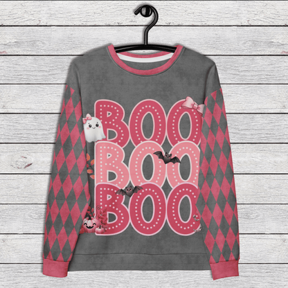 Gray sweatshirt with pink 'BOO BOO BOO' text and Halloween graphics on a wooden surface.