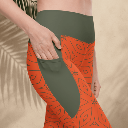 Person wearing green and orange patterned leggings with a beige background