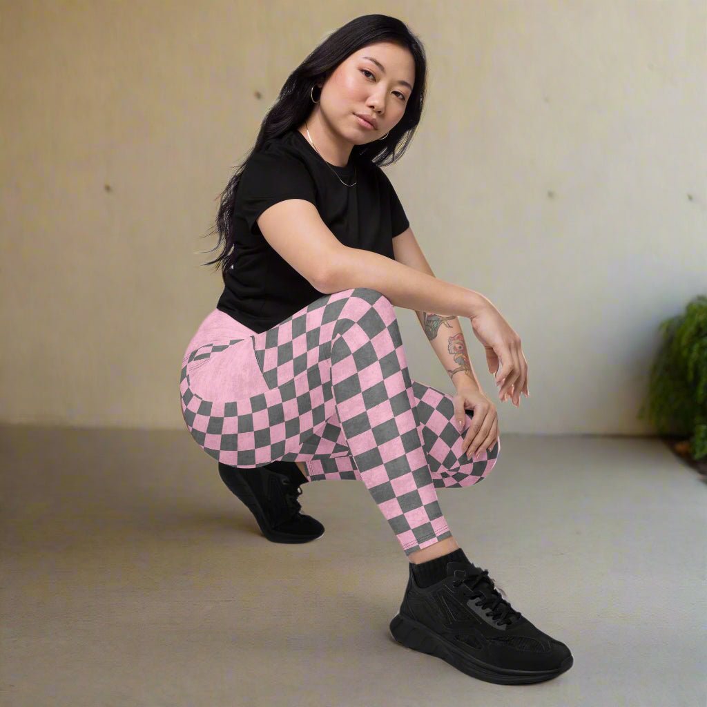 model crouching down while wearing Pink Checkered Print High-Waisted UPF 50+ Pocket Leggings 2XS–6XL