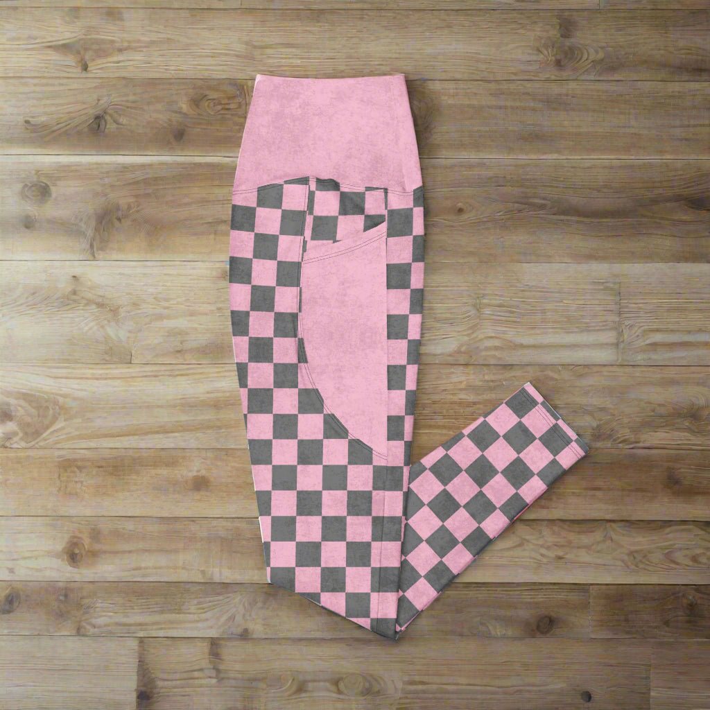 Pink Checkered Print High-Waisted UPF 50+ Pocket Leggings 2XS–6XL, folded on wood surface