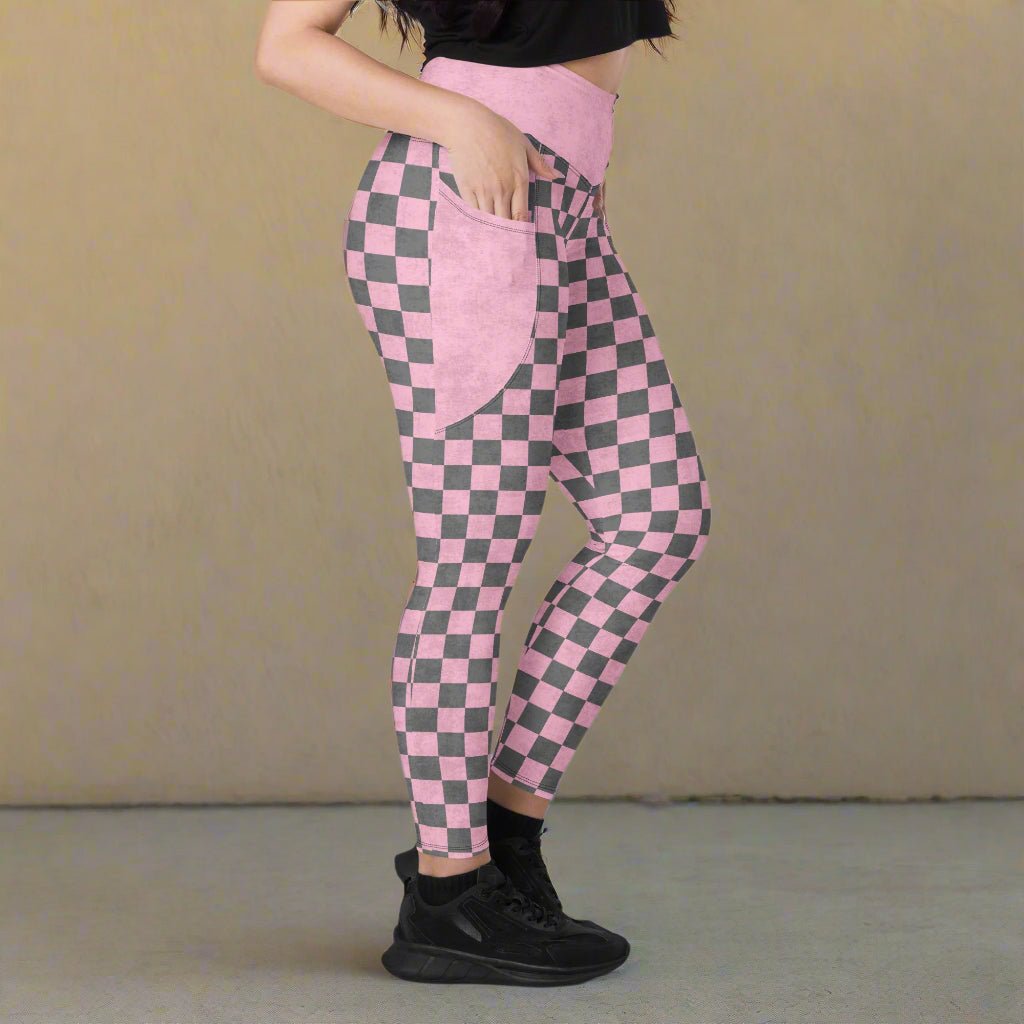 model with her hand in the pocket and facing the side while wearing Pink Checkered Print High-Waisted UPF 50+ Pocket Leggings 2XS–6XL