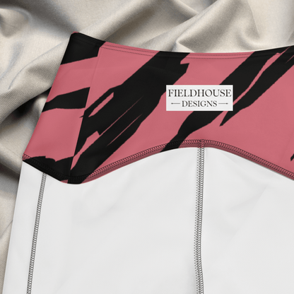 Close-up of a pink and black waistband with 'Fieldhouse Designs' branding on a textured fabric background.