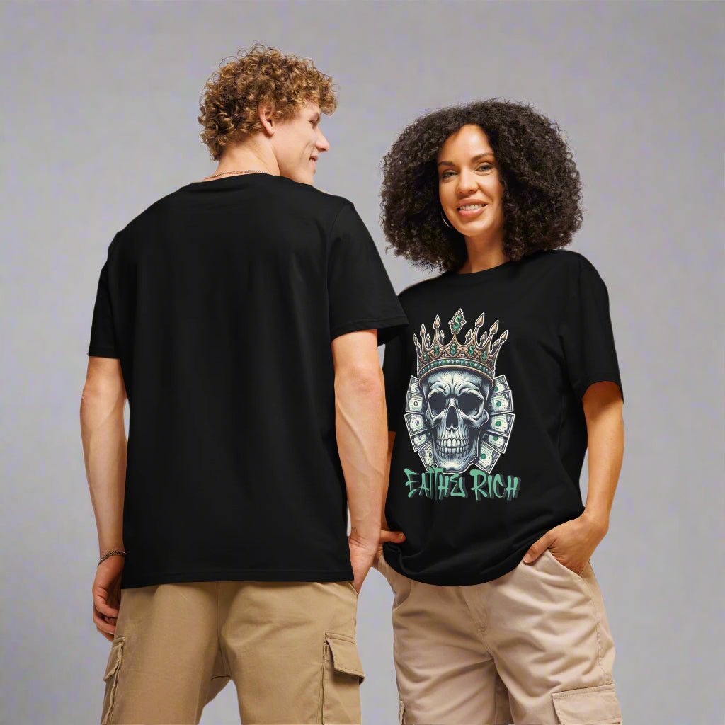 Two people wearing black t-shirts with a skull design and text on a plain background