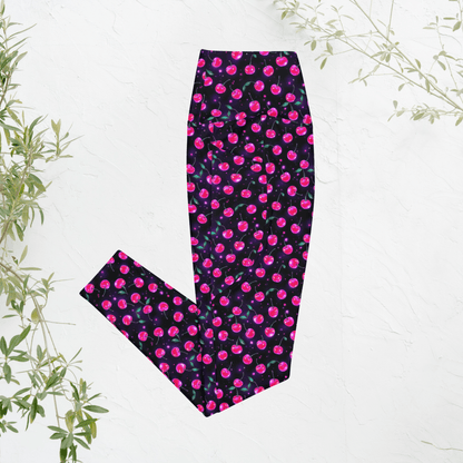 Leggings with pink cherry print on black on a white background