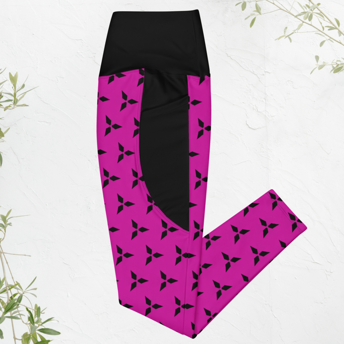Black and pink leggings with a geometric pattern on a white background