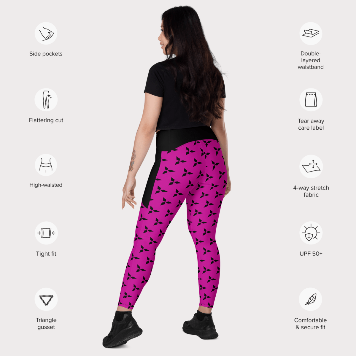 Woman wearing pink leggings with black patterns on a white background with feature icons.