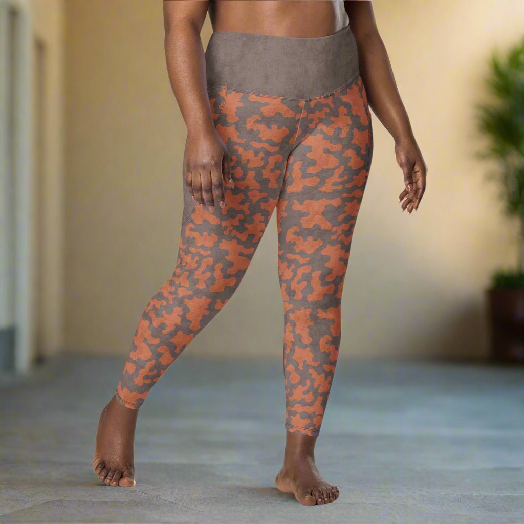 Person wearing camouflage leggings in an indoor setting