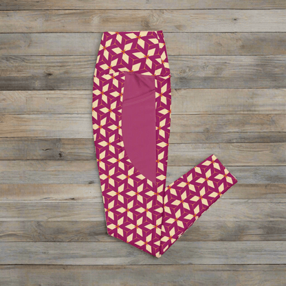 Purple leggings with cream geometric pattern on a wooden surface