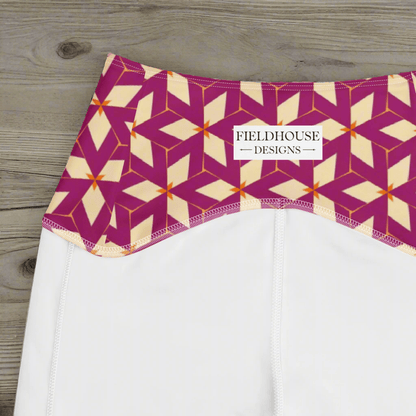 White pants with a geometric patterned waistband on a wooden surface, featuring 'Fieldhouse Designs' branding.