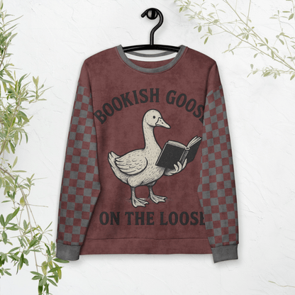 Sweatshirt with a goose holding a book design and text 'Bookish Goose on the Loose' on a hanger against a white background.