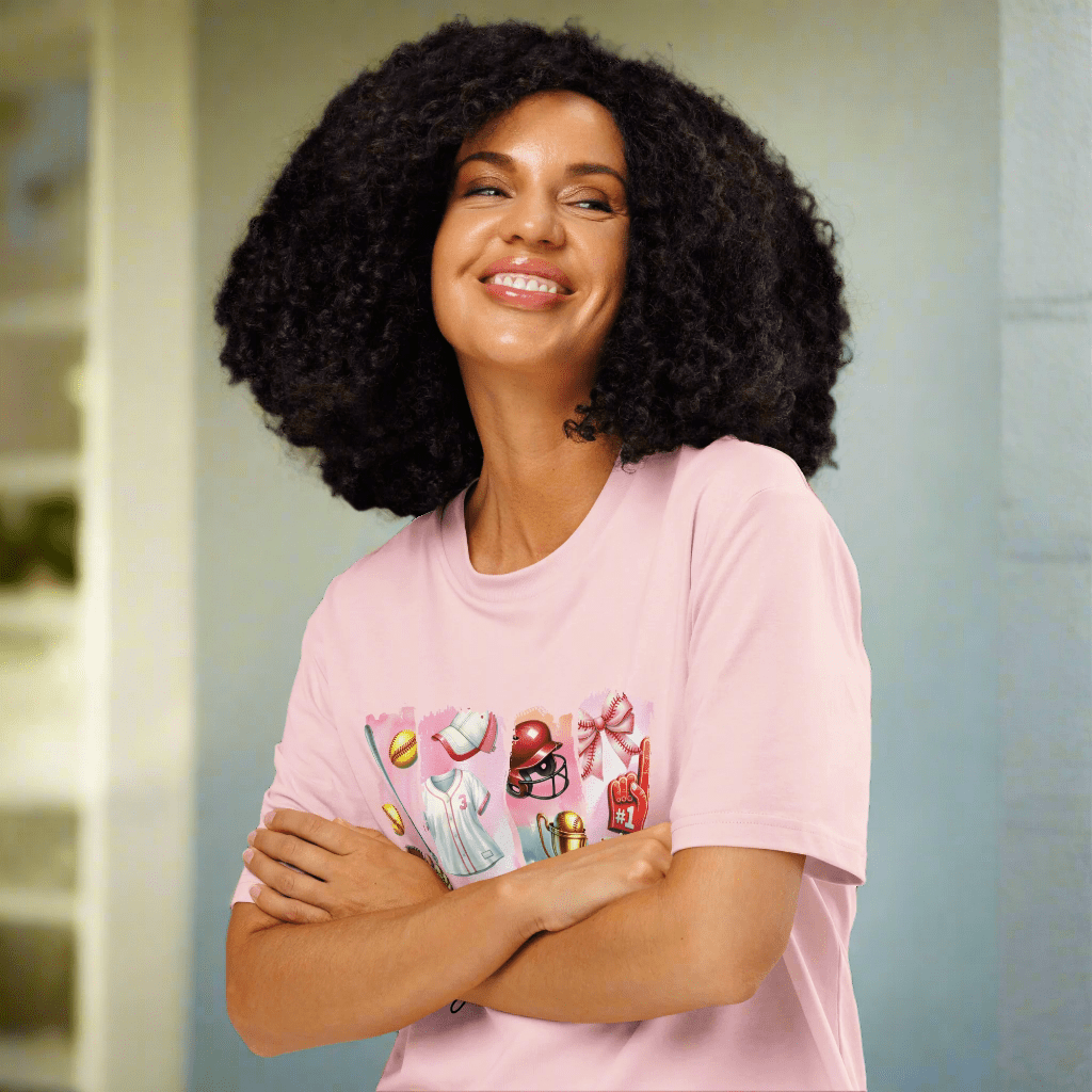 Woman wearing a pink t-shirt with colorful graphics on a neutral background