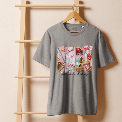 Gray t-shirt with "game day" graphic design on a wooden hanger against a beige wall.