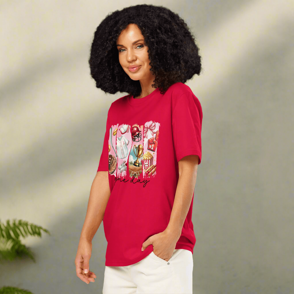 Woman wearing a red t-shirt with a graphic design on a neutral background