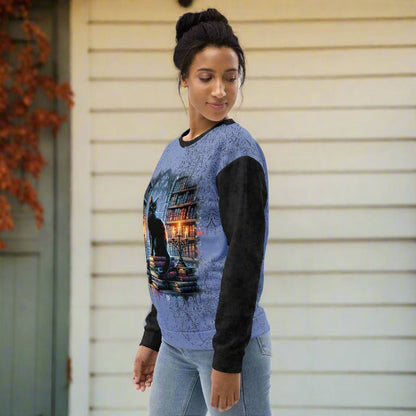 Woman wearing a blue and black sweater with a graphic design on a white background