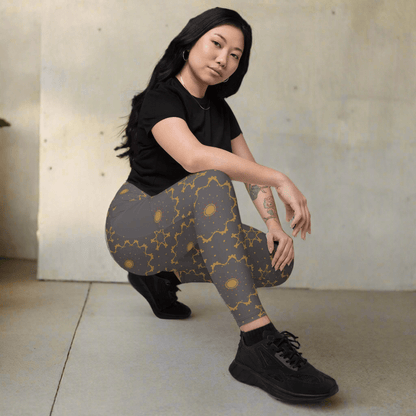 Woman wearing patterned leggings and black shoes on a beige background