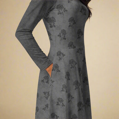 Gray dress with floral pattern on a beige background