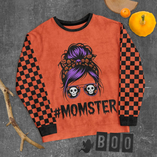 Orange sweatshirt with '#MOMSTER' design on a gray background