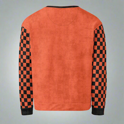 Orange sweatshirt with black and red checkered sleeves on a neutral background