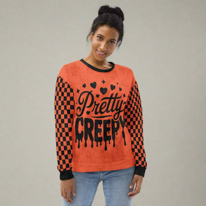 Person wearing a red and black checkered sweater with 'Pretty Creepy' text on a neutral background