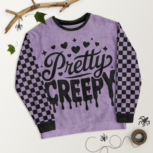 Purple sweatshirt with 'Pretty Creepy' text on a white background
