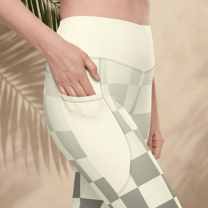 Person wearing a white and gray checkered pattern leggings with a blurred background