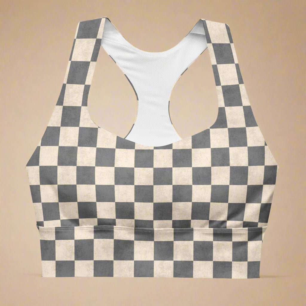 Checkered sports bra with a racerback on a beige background