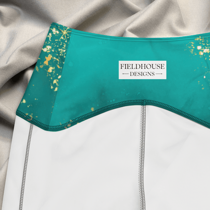 Teal waistband with gold speckles and 'Fieldhouse Designs' label on a gray fabric background