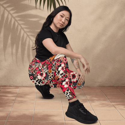 Woman wearing colorful floral pants and black shoes on a beige background
