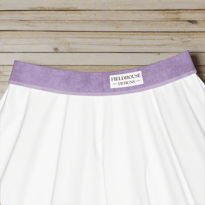 purple waistband and 'Fieldhouse Designs' label on a wooden background