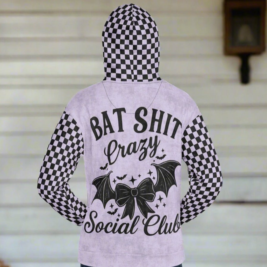 Hoodie with checkered pattern and text on a plain background