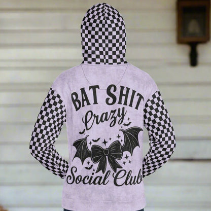 Hoodie with checkered pattern and text on a plain background
