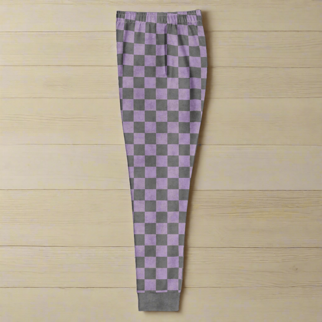 Checkered pants with purple and gray pattern on a wood background