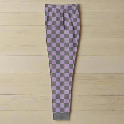 Checkered pants with purple and gray pattern on a wood background