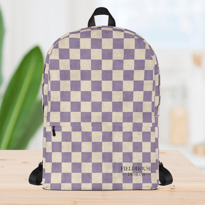 Checkered backpack with purple and beige pattern on a wooden surface